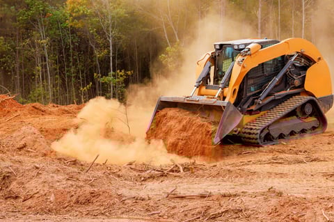 Heavy machinery clearing land